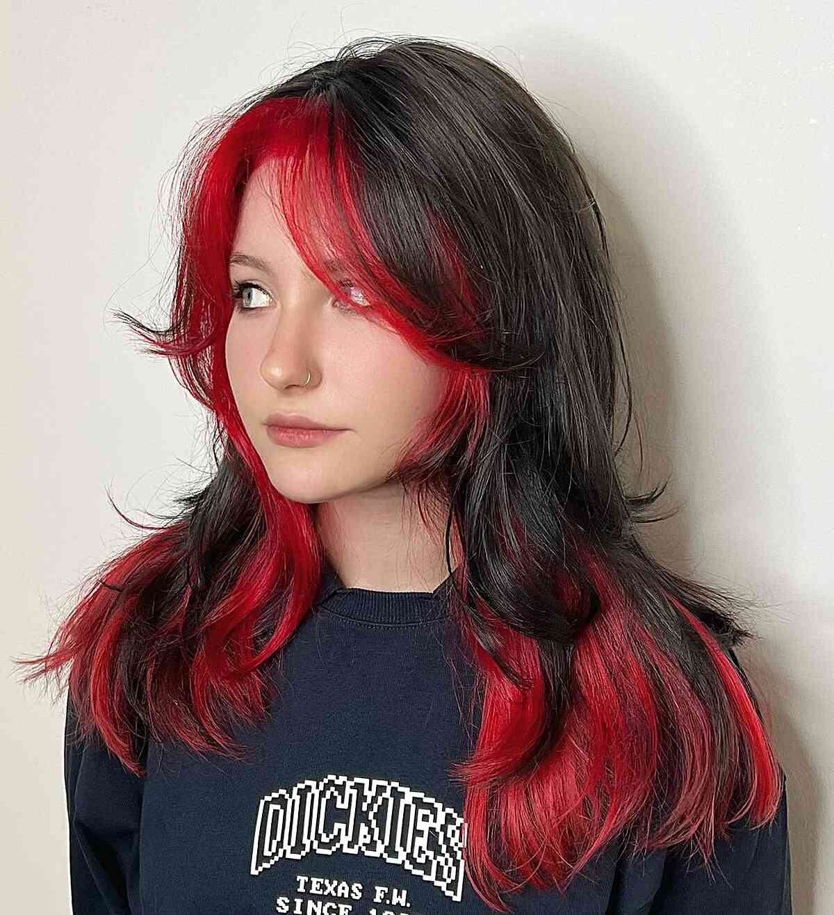 Long Black and Red Wolf Cut with Flipped Layers and Curtain Bangs