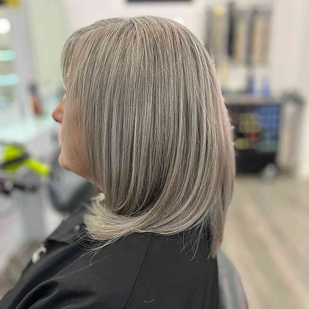 Medium Grey Hair with Ash Brown Hue for Older Women Aged 50