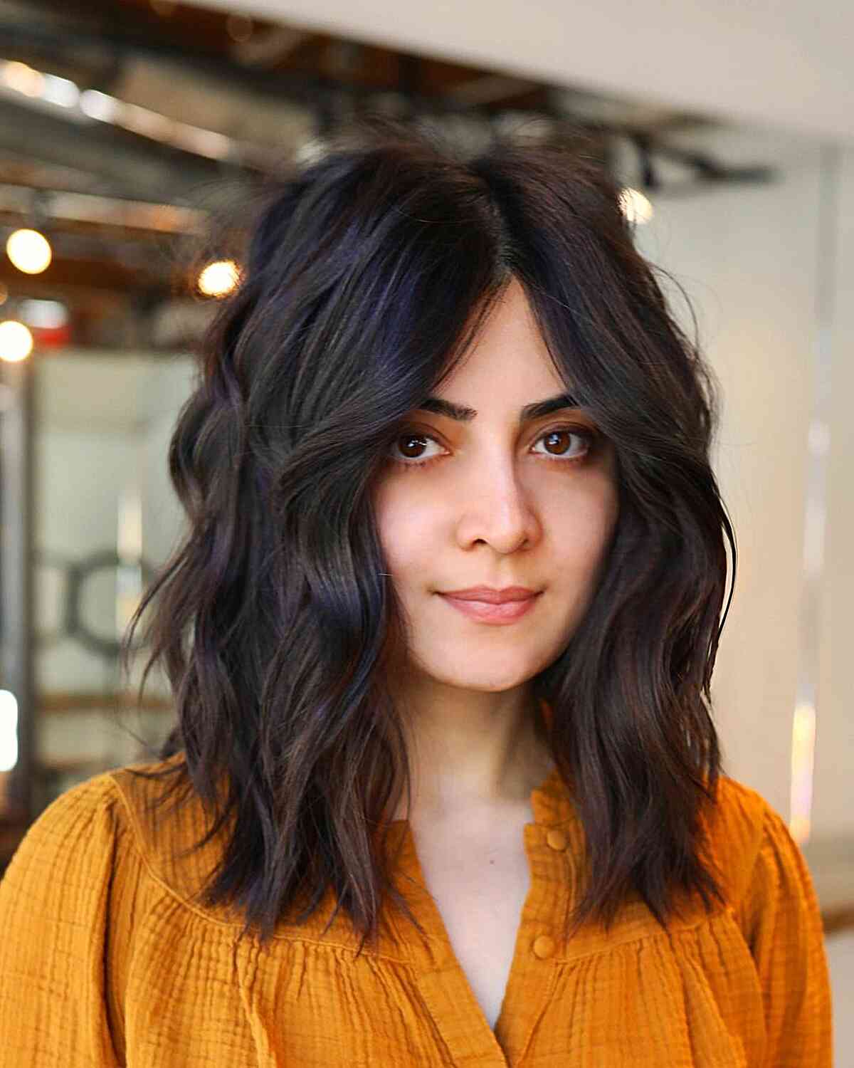 Messy Center-Parted Medium Cut for Collarbone-Length Hair with loose waves