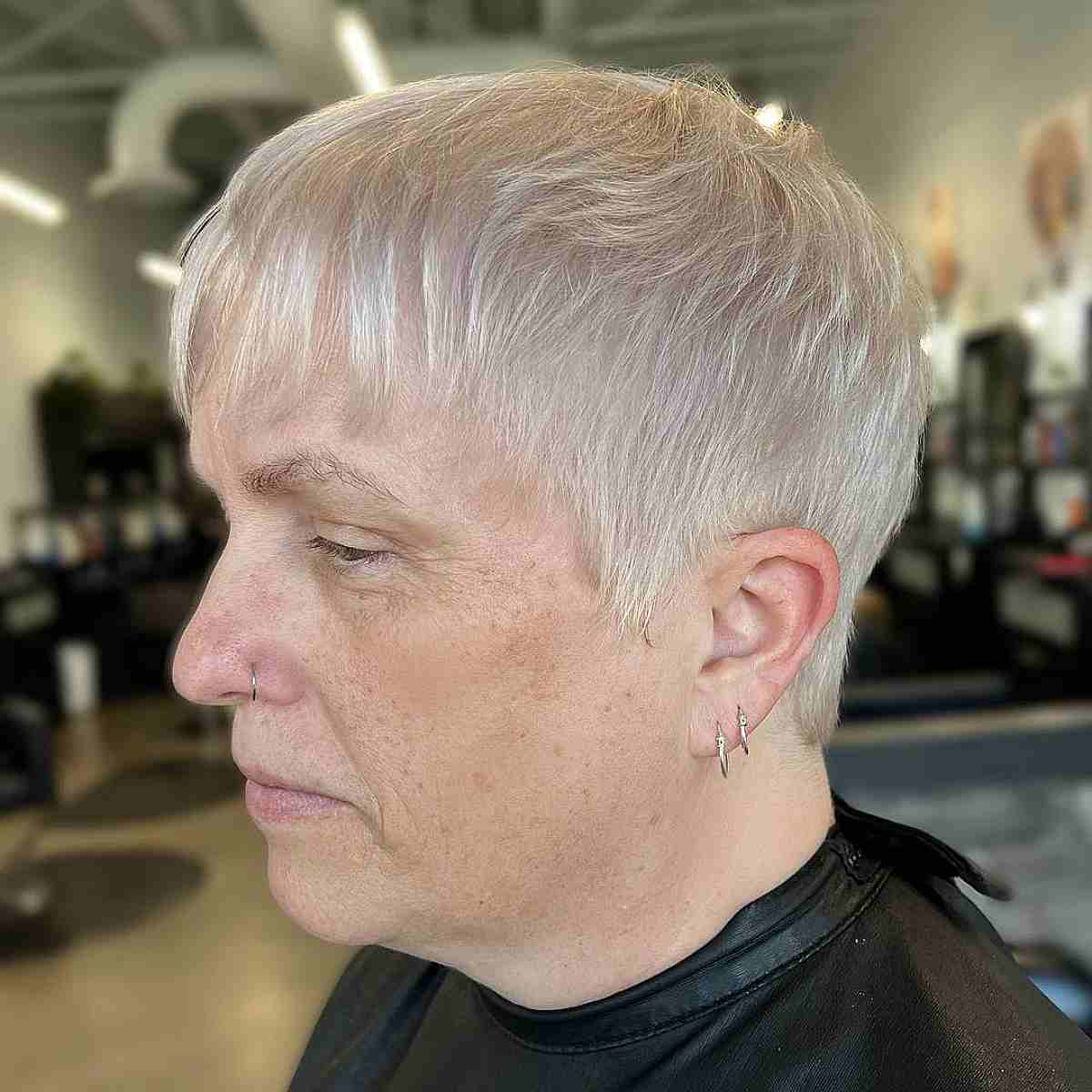 Trendy Platinum Pixie with a Wispy Fringe for Thinning Hair