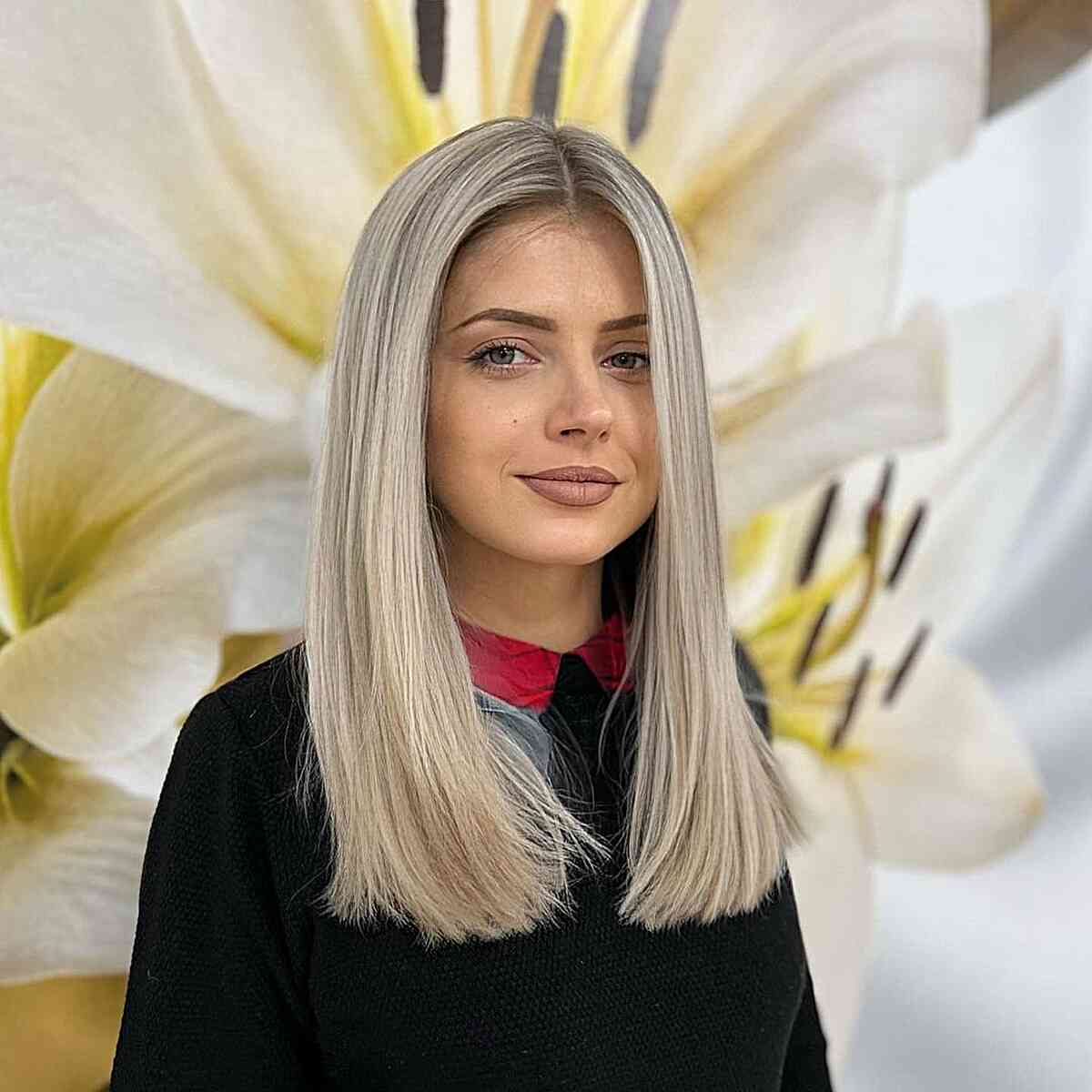 Stunningly Sleek Straight Haircut with a center part for women in their 30s