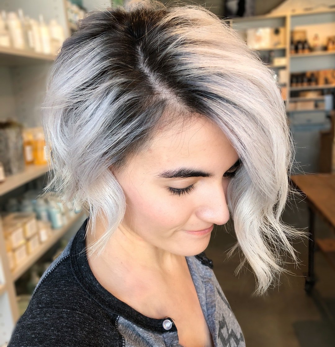 Rooted and Blonde Asymmetrical Bob with Beachy Waves